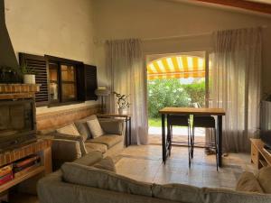 a living room with a couch and a table at Villa Evelina Puerto Rey Vera in Vera