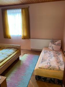 Postel nebo postele na pokoji v ubytování KochGaranas Ferienhaus