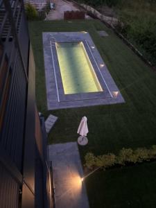 an overhead view of a swimming pool in a yard at Casa 32 in Nago-Torbole