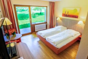 Postel nebo postele na pokoji v ubytování Wohlfühlhotel Sonnengarten