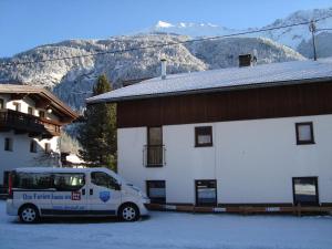 a white van parked in front of a building at Der große Stadl in Oberried