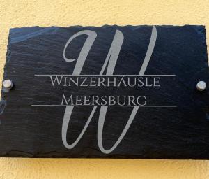 a sign that says winemaker intake metreuingavascriptavascriptavascript at Seeblick - Chice Maisonette über den Dächern von Meersburg in Meersburg
