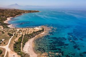an aerial view of a beach and the ocean at Torre dei 7 Frati in Cefalù +47 photos