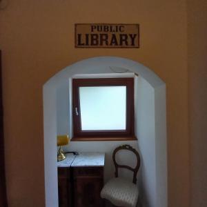 a room with a desk and a chair and a window at Waldboden in San Leonardo in Passiria