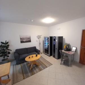 a living room with a couch and a table at Waldboden in San Leonardo in Passiria
