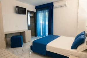 Voodi või voodid majutusasutuse Hotel Cocceio toas