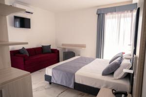 Voodi või voodid majutusasutuse Hotel Cocceio toas