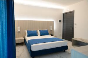 Voodi või voodid majutusasutuse Hotel Cocceio toas