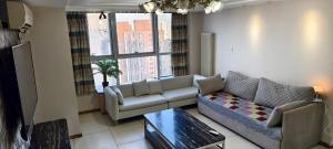 Un lugar para sentarse en Chaoyang Joy City Hardcover Apartment