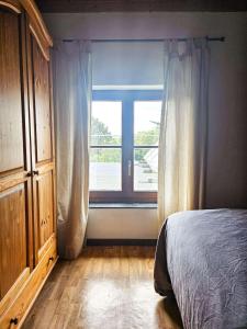 Vue sur les collines tesisinde bir odada yatak veya yataklar