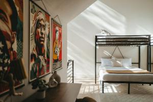 a bedroom with a bed with a poster of obama at Onyx & Cedar Lakehouse in Garfield