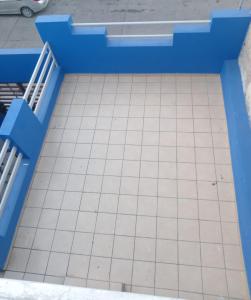 a blue bench with a tiled floor at Vacacional Mazatlan in Mazatlán
