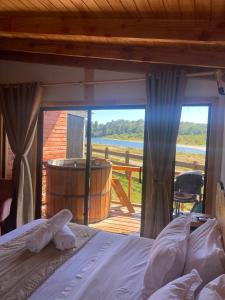 Postel nebo postele na pokoji v ubytování El Encanto de Antilhue