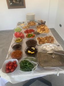 a table with many different types of food on it at Melissaotelgokceada in Gokceada Town