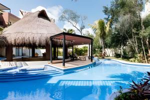 Kolam renang di atau dekat dengan Casa de lujo Ka'an Maya acceso SwimUp a la piscina
