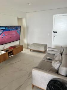 Televisyen dan/atau pusat hiburan di Apartamento Best