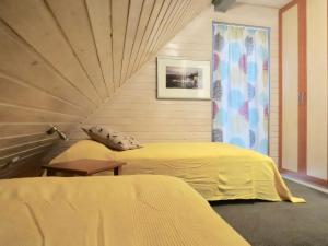 Ένα ή περισσότερα κρεβάτια σε δωμάτιο στο Natur pur mit Sauna und Kamin