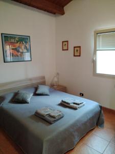 Ένα ή περισσότερα κρεβάτια σε δωμάτιο στο Mansarda con terrazzo privato +18 φωτογραφίες