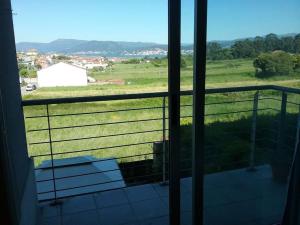 a view of a field from a window at Loue appartement à A Guarda in A Guarda