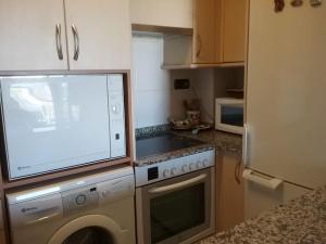 Η κουζίνα ή μικρή κουζίνα στο Loue appartement à A Guarda