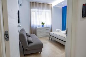 Postel nebo postele na pokoji v ubytování Urban Oasis
