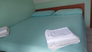 Una cama o camas en una habitación de Tramonto sul Tirreno