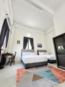 Postel nebo postele na pokoji v ubytování Ferringhi Inn 51