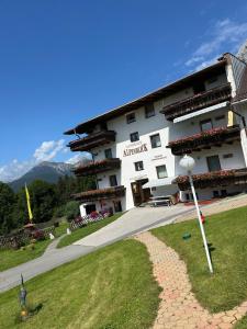 a large building with balconies on the side of it at Landhaus Alpenblick in Obsteig