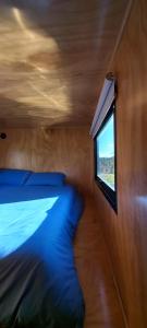Ein Bett oder Betten in einem Zimmer der Unterkunft Rumi Azulada - La Calera