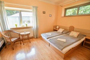 Posteľ alebo postele v izbe v ubytovaní Apartmány Ados