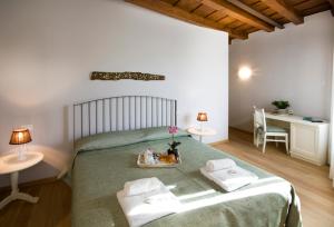 Postel nebo postele na pokoji v ubytování Residenza CuordiVerona
