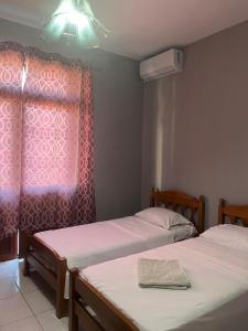 Postel nebo postele na pokoji v ubytování Hotel Luli City Center