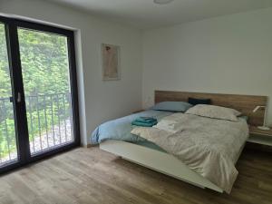 Postel nebo postele na pokoji v ubytování Hiša Oblak