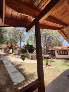 a view from the porch of a wooden pergola at Travels in Mazamitla +4 photos