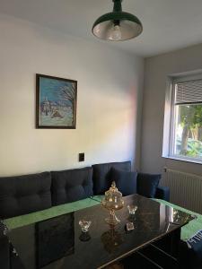 a living room with a table and a couch at BT Apartments in Strumica
