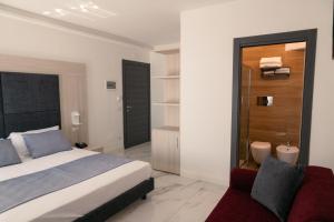 Voodi või voodid majutusasutuse Hotel Cocceio toas