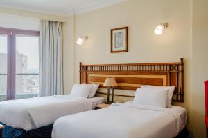Om Kolthoom Hotel客房内的一张或多张床位