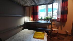 Posteľ alebo postele v izbe v ubytovaní Apartament Osiedle Garnizon
