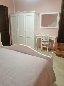 Ένα ή περισσότερα κρεβάτια σε δωμάτιο στο Al Carpine