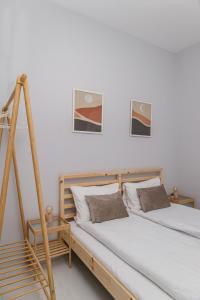 two beds sitting next to each other in a room at Cozy Studio in the City Center in Thessaloniki