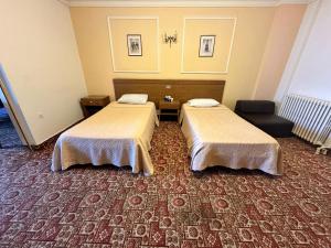 Postel nebo postele na pokoji v ubytování Le Crillon