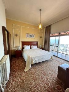 Postel nebo postele na pokoji v ubytování Le Crillon