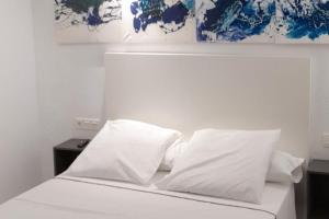 Postel nebo postele na pokoji v ubytování Innova Spaces Málaga