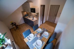 TV a/nebo společenská místnost v ubytování Apartmány Hasičárna