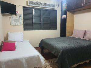 Suite com ar客房内的一张或多张床位