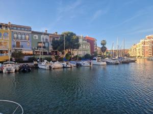 a group of boats are docked in a marina at Port Saplaya 2 habitaciones Valencia in Port Saplaya