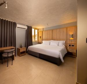 Postel nebo postele na pokoji v ubytování Mood Matuna Hotel Cartagena
