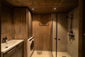 a bathroom with a shower and a sink at Storefjell Resort - Panorama apartments in Gol +37 photos