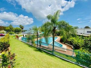 an image of a swimming pool at a house with a fence at Modern Penthouse in Carolina in Cuatro Caminos