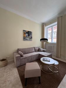 a living room with a couch and a table at Old Town Residence, Historic Centre Castle Square in Warsaw